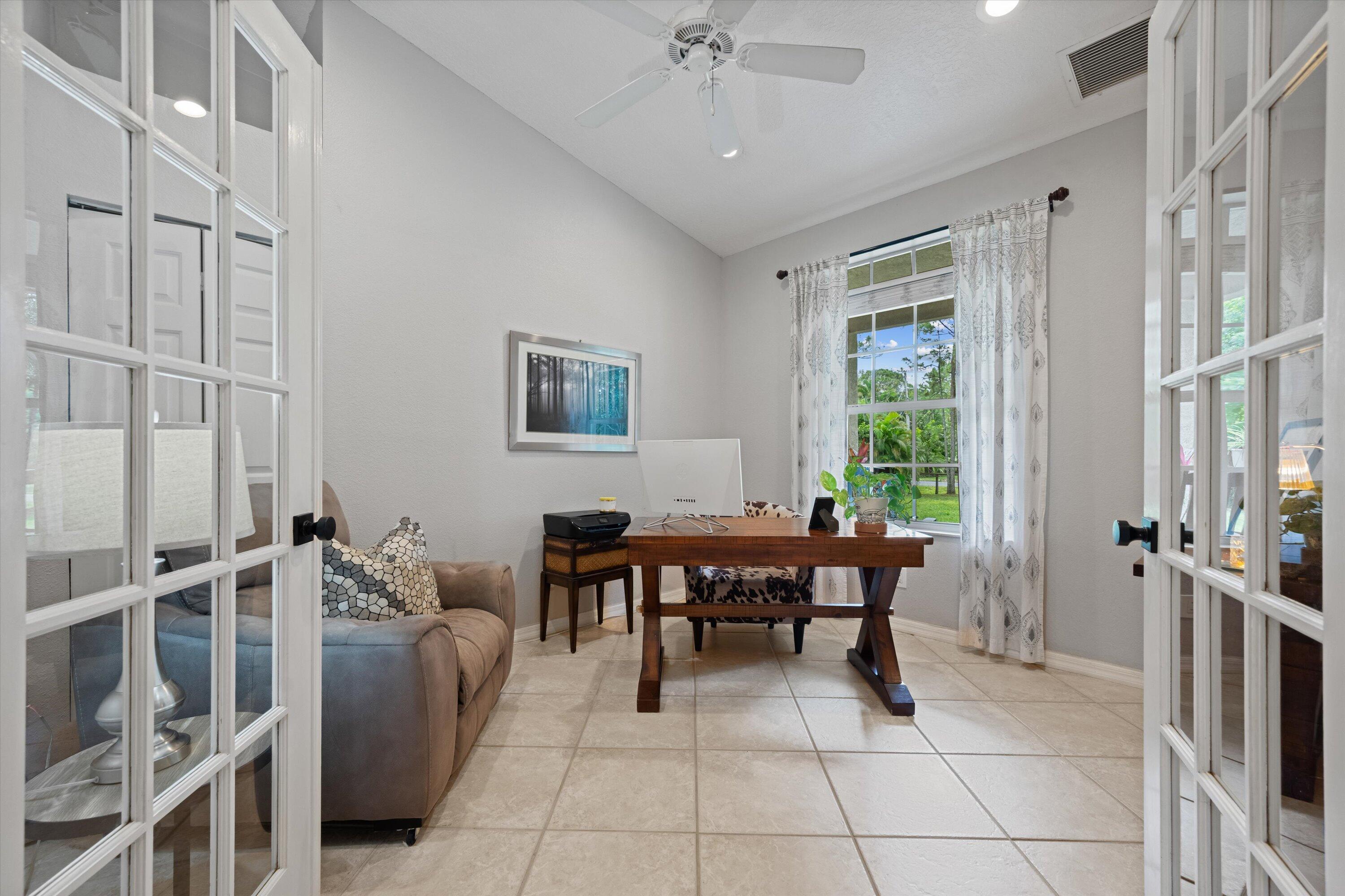 10771 154th Road North Jupiter, FL 33478 - Photo 26 of 87 a view of a dining room with furniture window and outside view