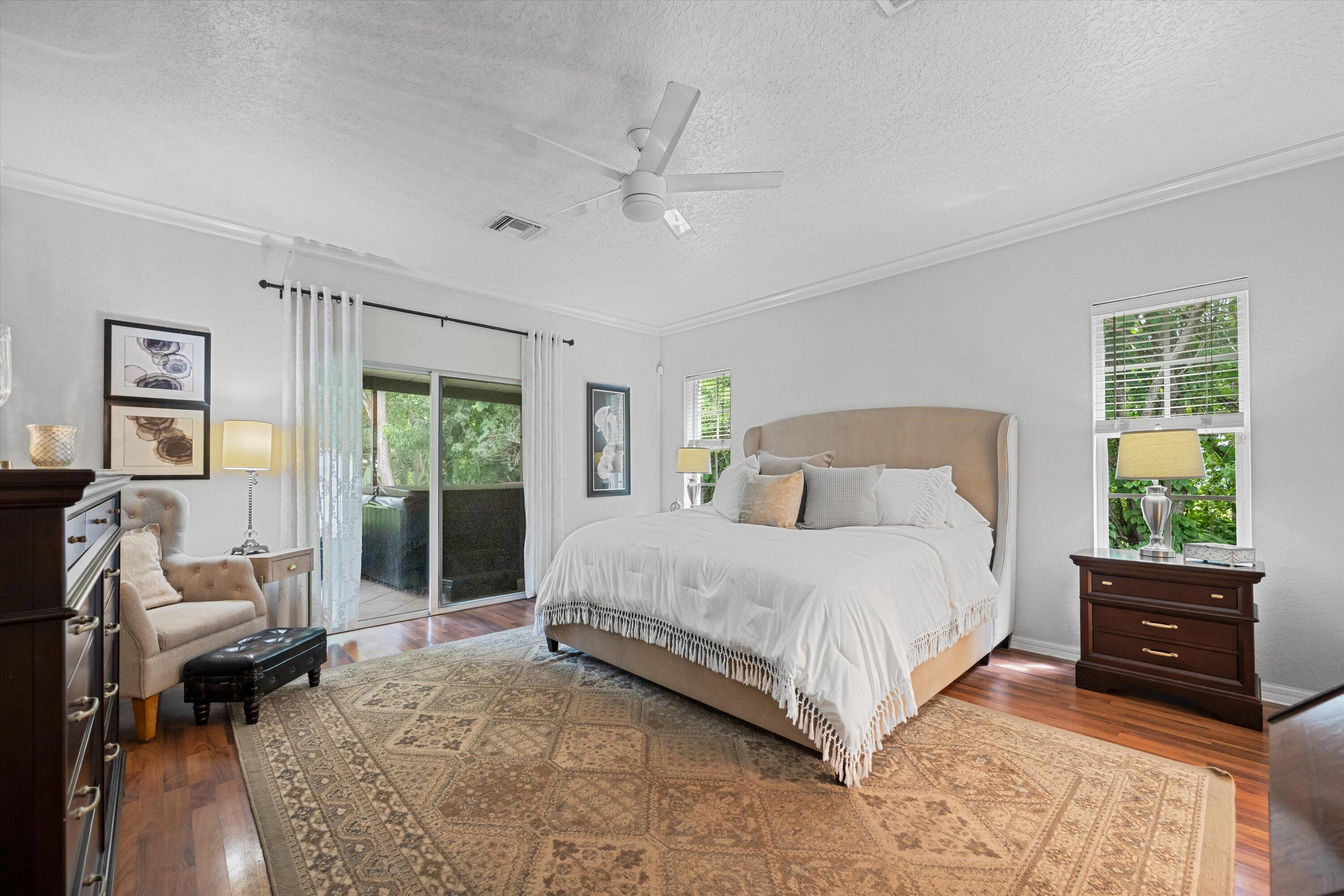 10771 154th Road North Jupiter, FL 33478 - Photo 30 of 87 a bedroom with a bed and a window