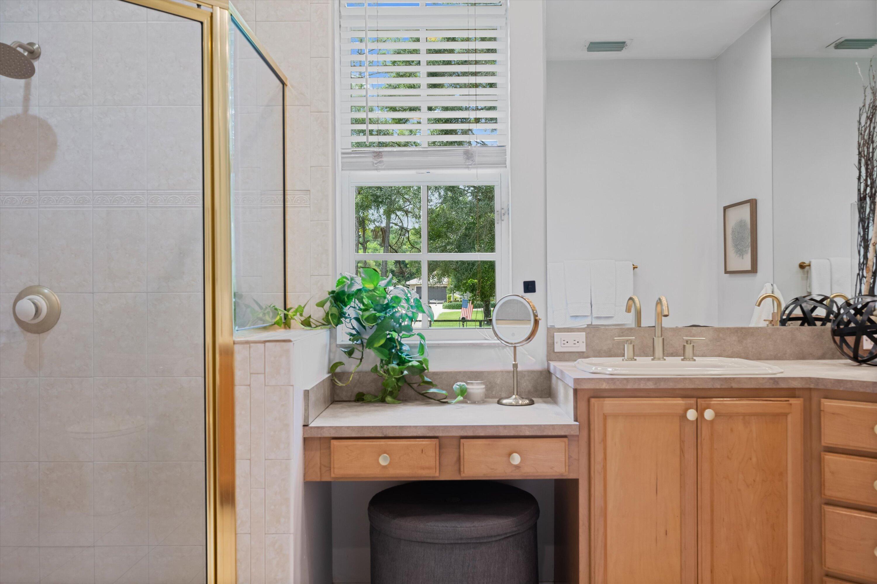 10771 154th Road North Jupiter, FL 33478 - Photo 37 of 87 a room with a sink and a mirror