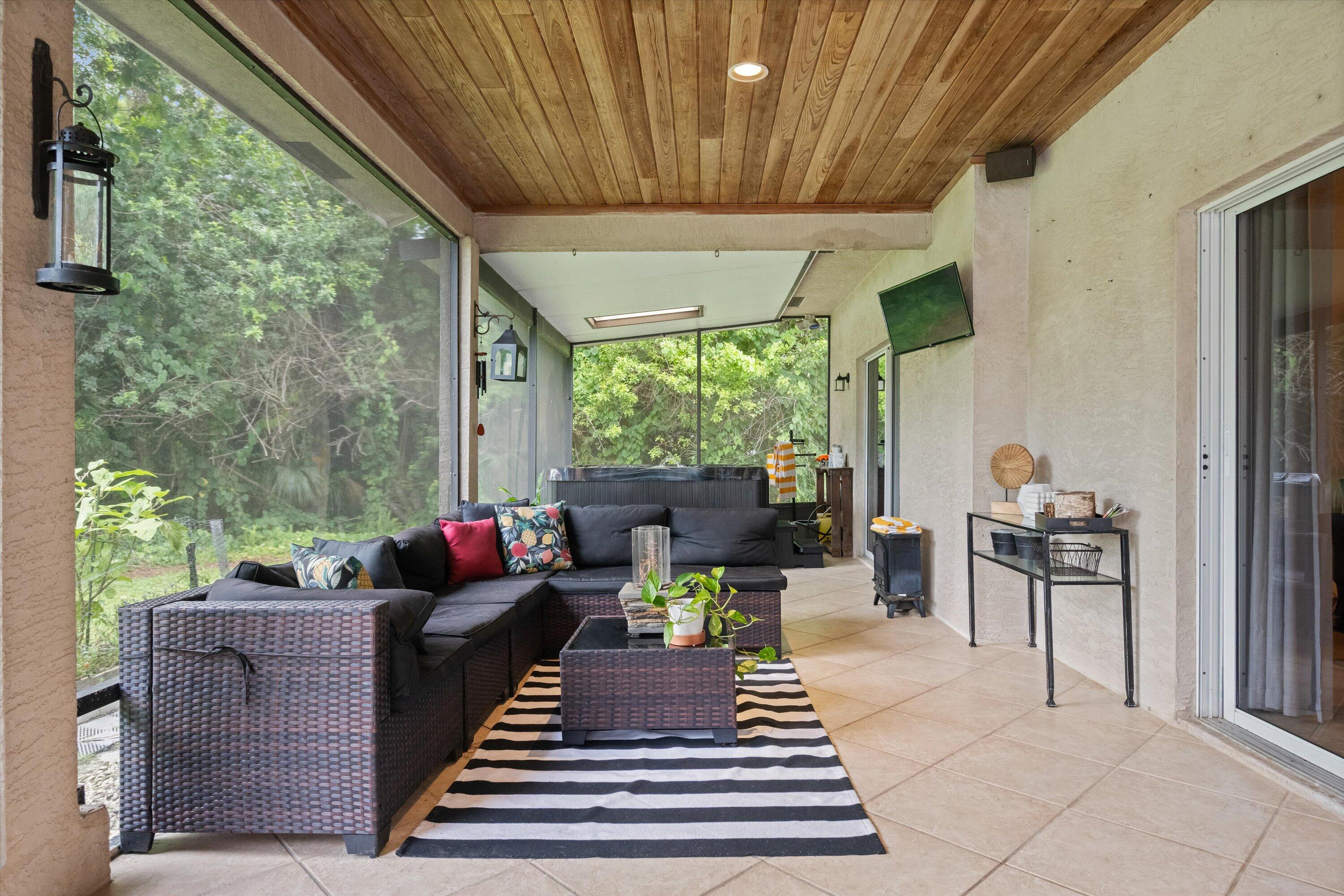 10771 154th Road North Jupiter, FL 33478 - Photo 48 of 87 a living room with furniture and a large window