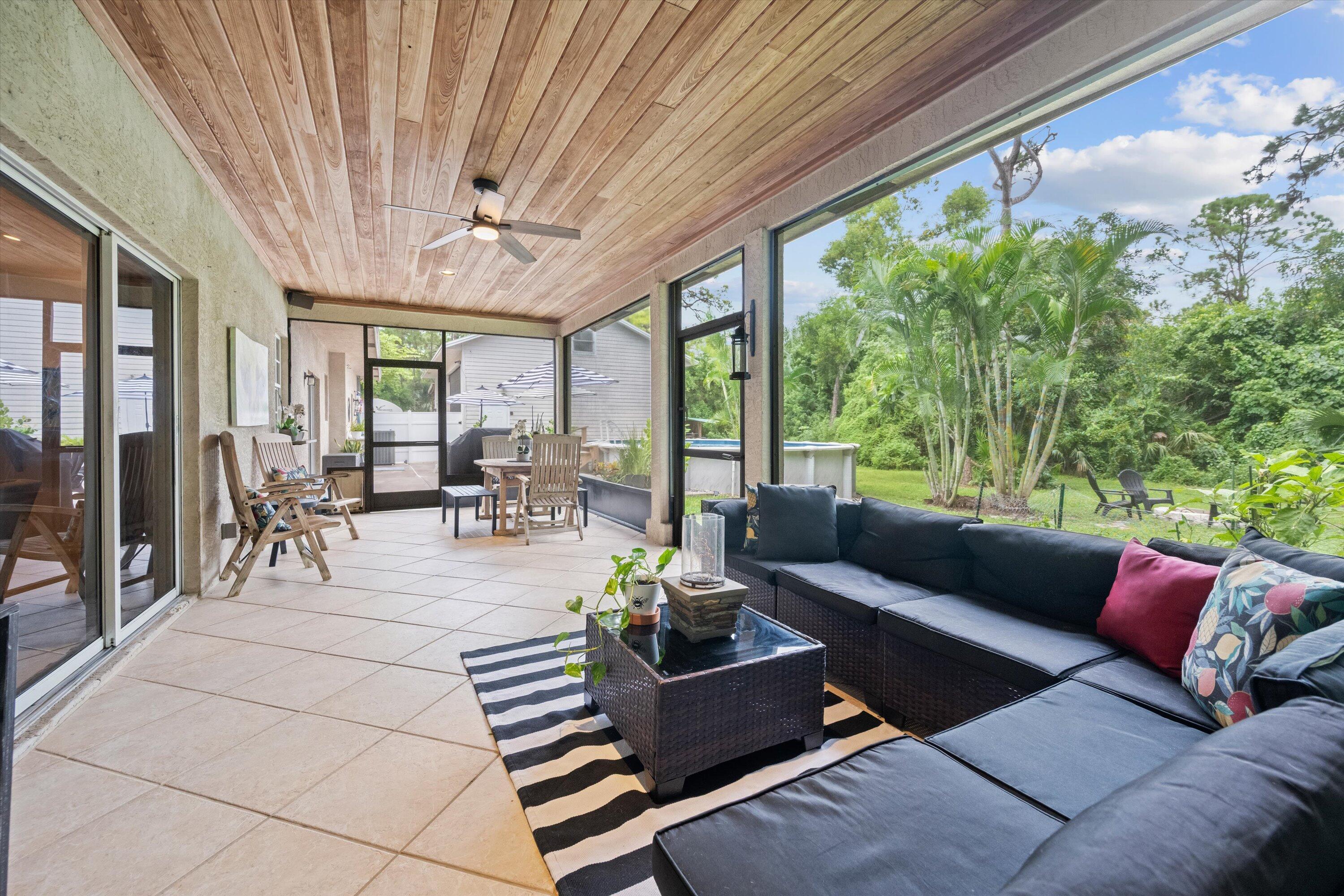 10771 154th Road North Jupiter, FL 33478 - Photo 55 of 87 a living room with furniture and a large window