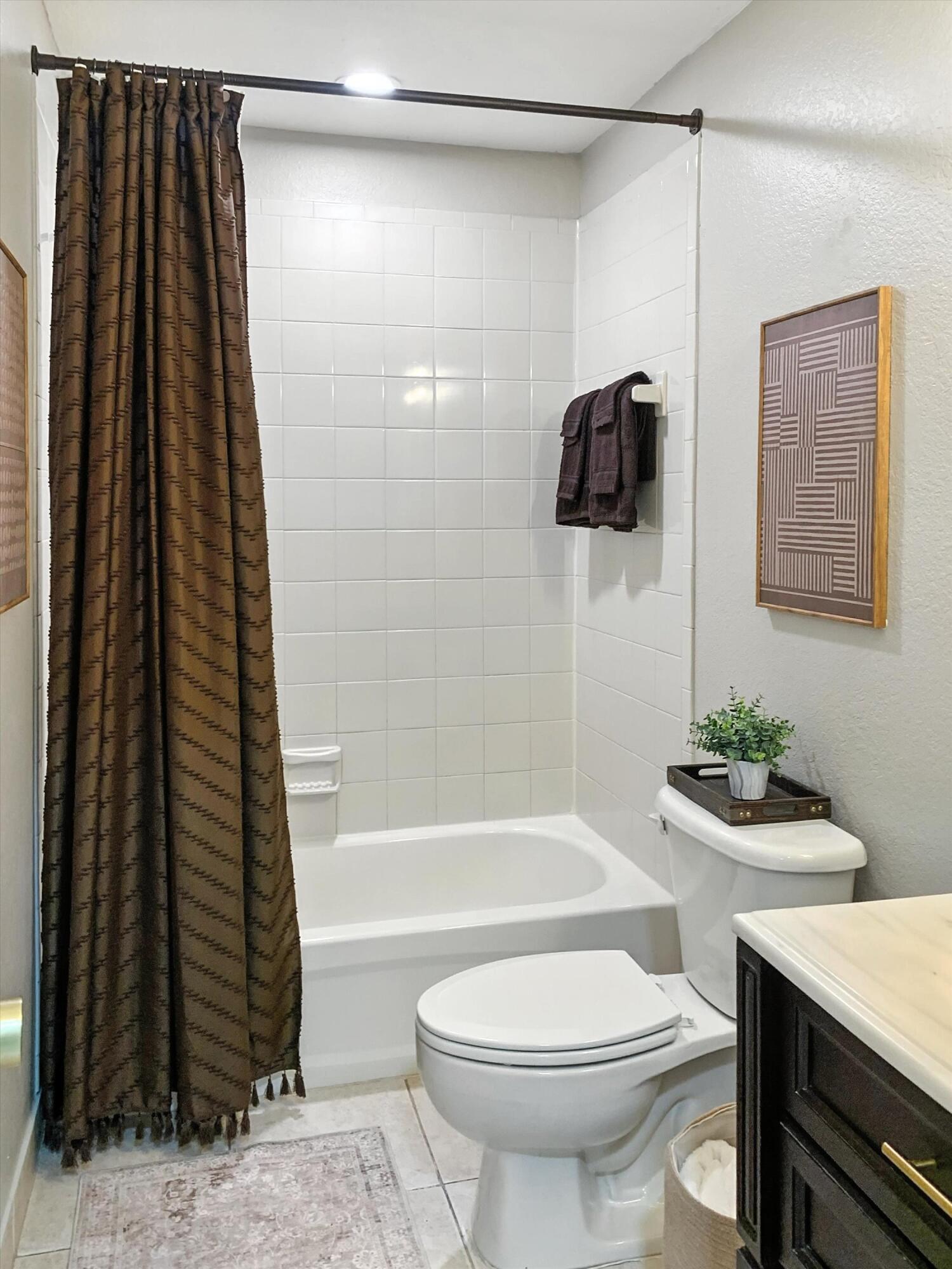 10771 154th Road North Jupiter, FL 33478 - Photo 73 of 87 a bathroom with a sink a toilet and shower