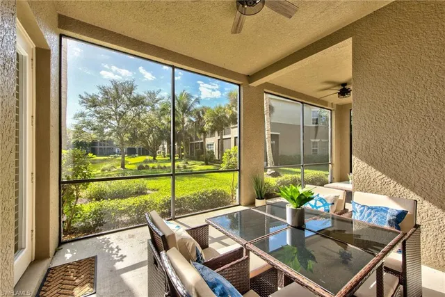 a view of a dining room with furniture window and outside view