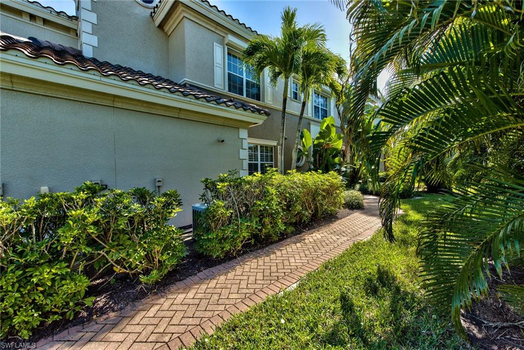 Undisclosed Address Naples, FL 34114 - Photo 22 of 25 a view of a house with a garden