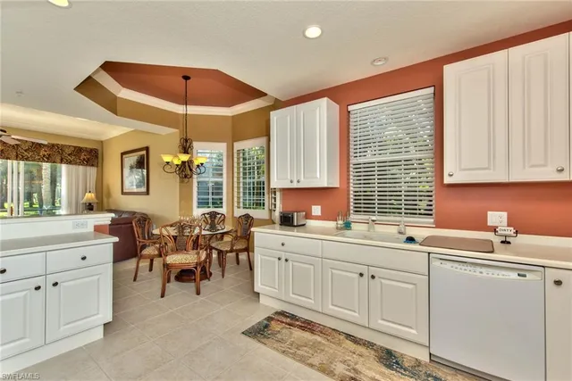 a kitchen with sink and cabinets