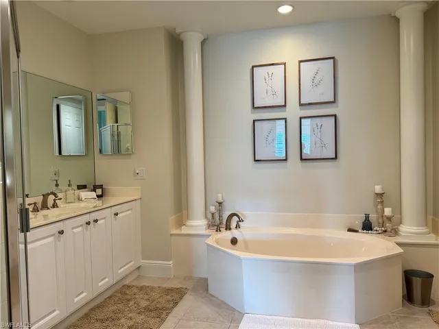 a bathroom with a bathtub and a sink
