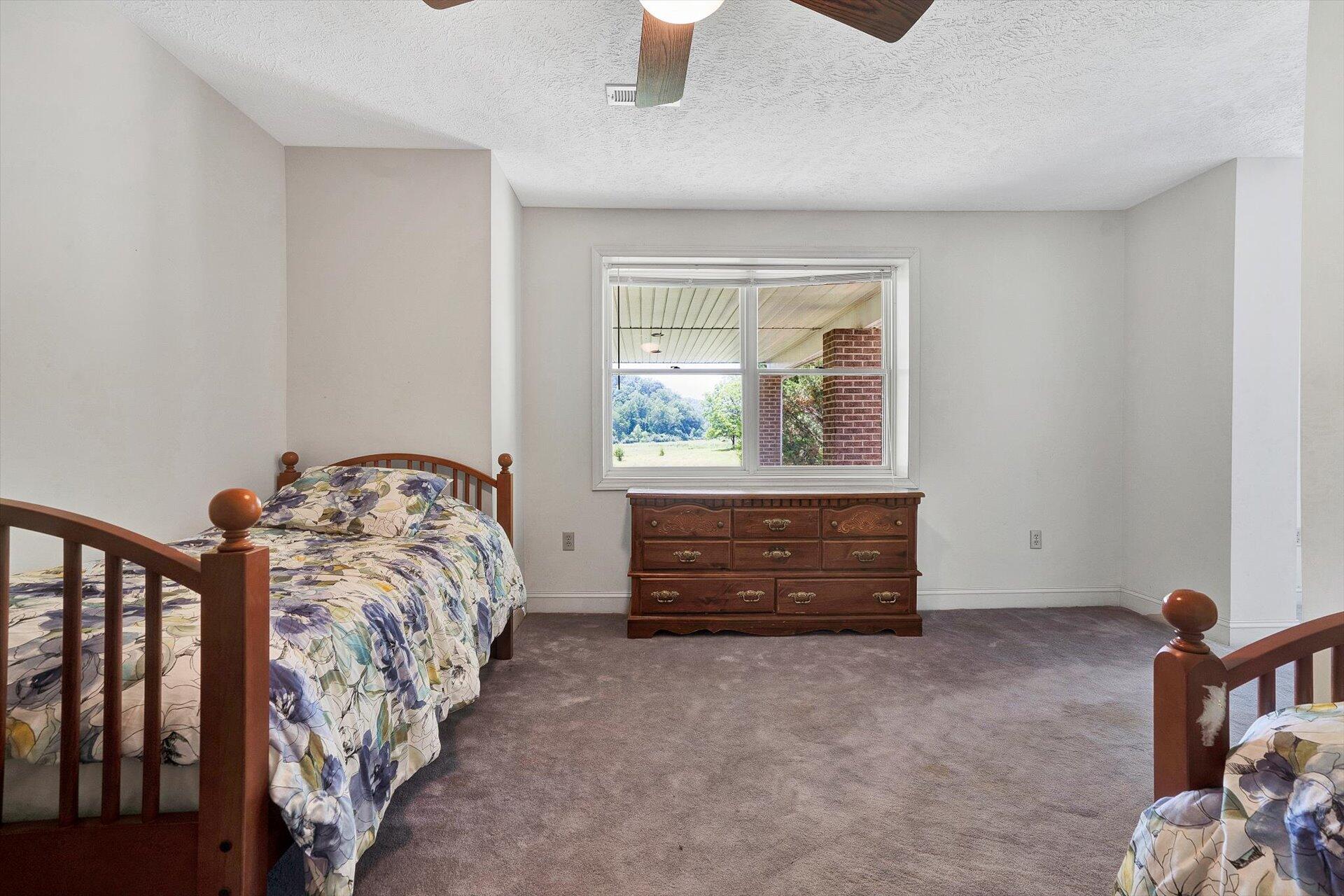 2446 Deer Run Road Ferrum, VA 24088 - Photo 104 of 145 a bed room with a bed and a window