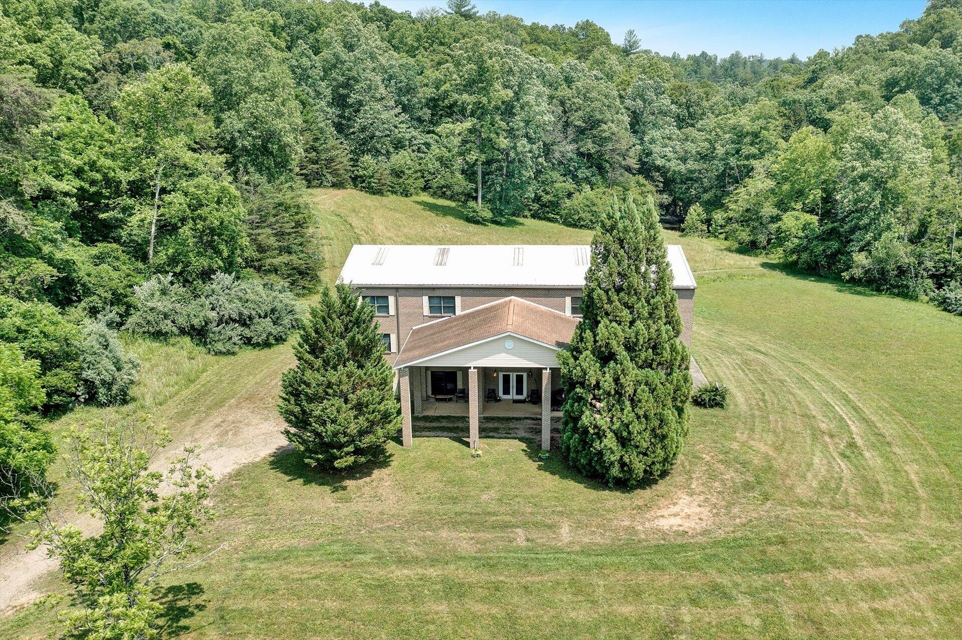 2446 Deer Run Road Ferrum, VA 24088 - Photo 112 of 145 a front view of a house with a yard