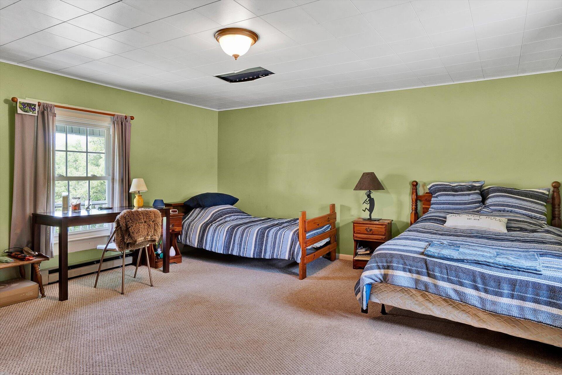 2446 Deer Run Road Ferrum, VA 24088 - Photo 35 of 145 a bedroom with bed and a window