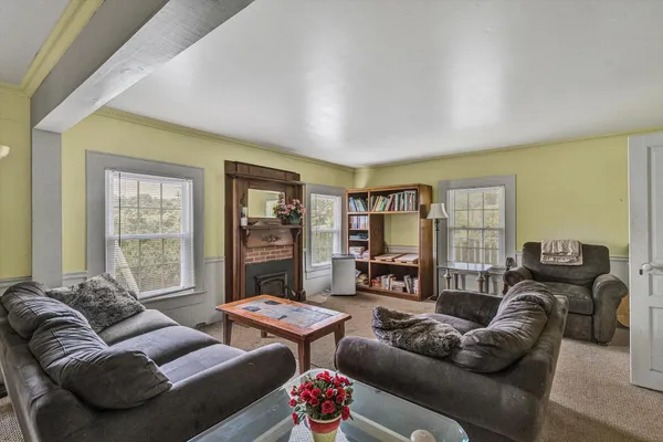 a bedroom with furniture and a window