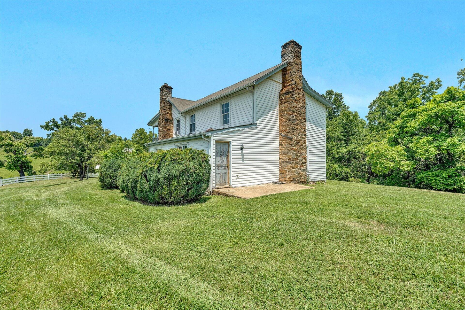 2446 Deer Run Road Ferrum, VA 24088 - Photo 55 of 145 a front view of a house with a yard