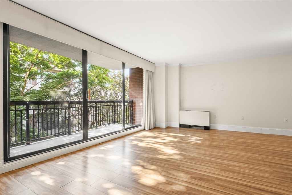 50 Longwood Avenue, Unit 518 Brookline, MA 02446 - Photo 12 of 33 a view of a room with wooden floor and windows