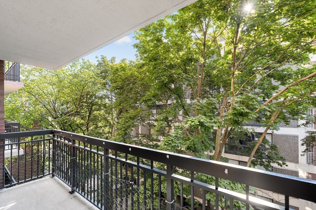 50 Longwood Avenue, Unit 518 Brookline, MA 02446 - Photo 22 of 33 a balcony with trees in front of it