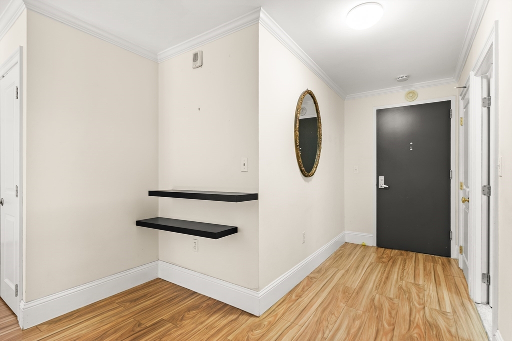 50 Longwood Avenue, Unit 518 Brookline, MA 02446 - Photo 6 of 33 a view of a room with wooden floor and white wall