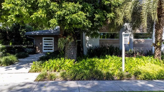a backyard of a house with lots of green space