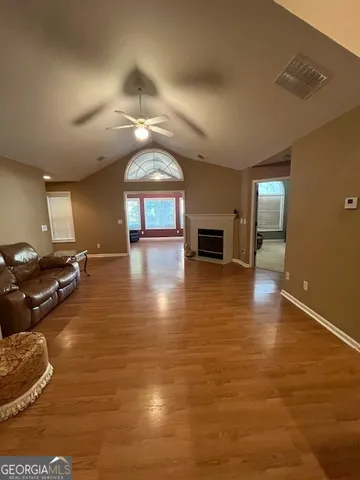 a lobby with furniture and a fireplace