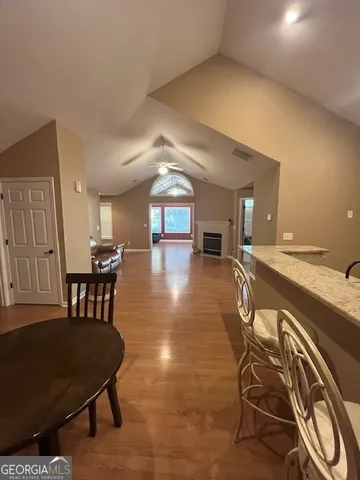 a view of a livingroom with furniture and a table