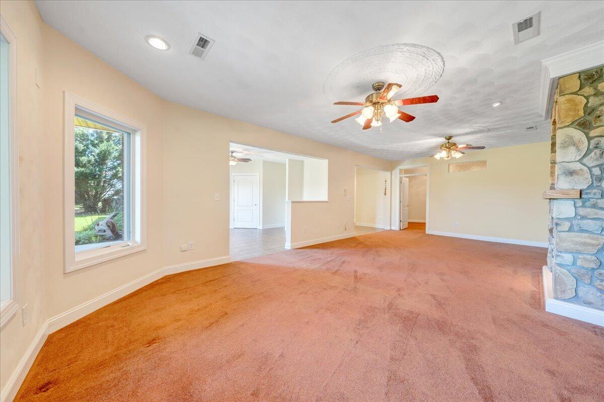 625 Frontier Way Fincastle, VA 24090 - Photo 64 of 105 a view of a big room with windows and chandelier fan
