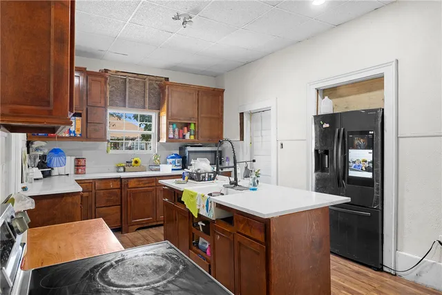a kitchen with a sink stove and cabinets