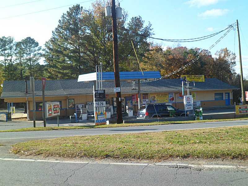 a front view of a building with a yard