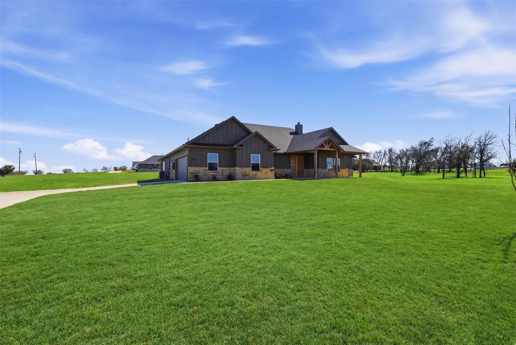 6657 Buffalo Ridge Circle Godley, TX 76044 - Photo 6 of 31 a view of a house with a big yard