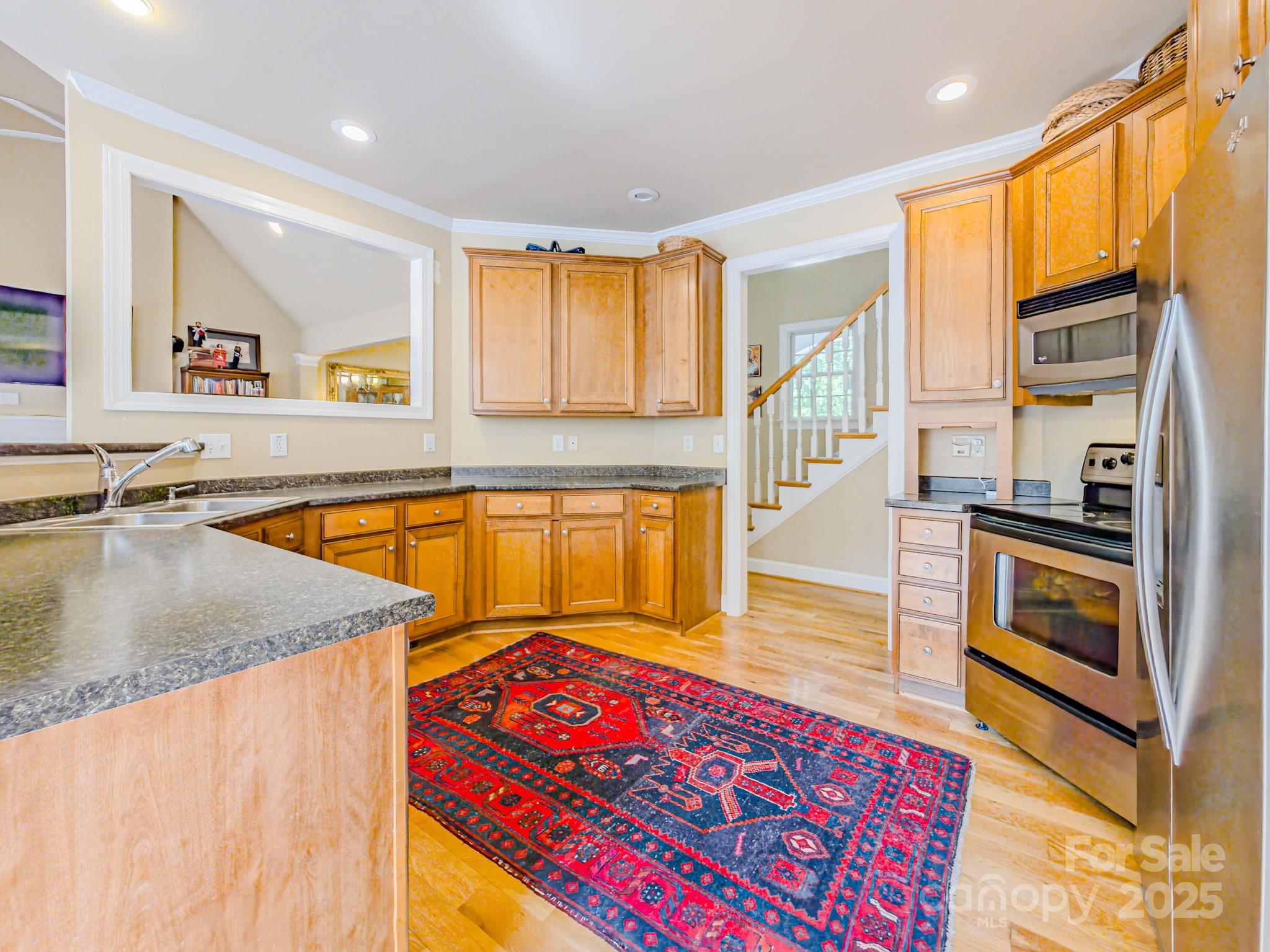 196 Col Hamptons Court Rutherfordton, NC 28139 - Photo 13 of 47 a kitchen with stainless steel appliances granite countertop a stove a sink and a microwave