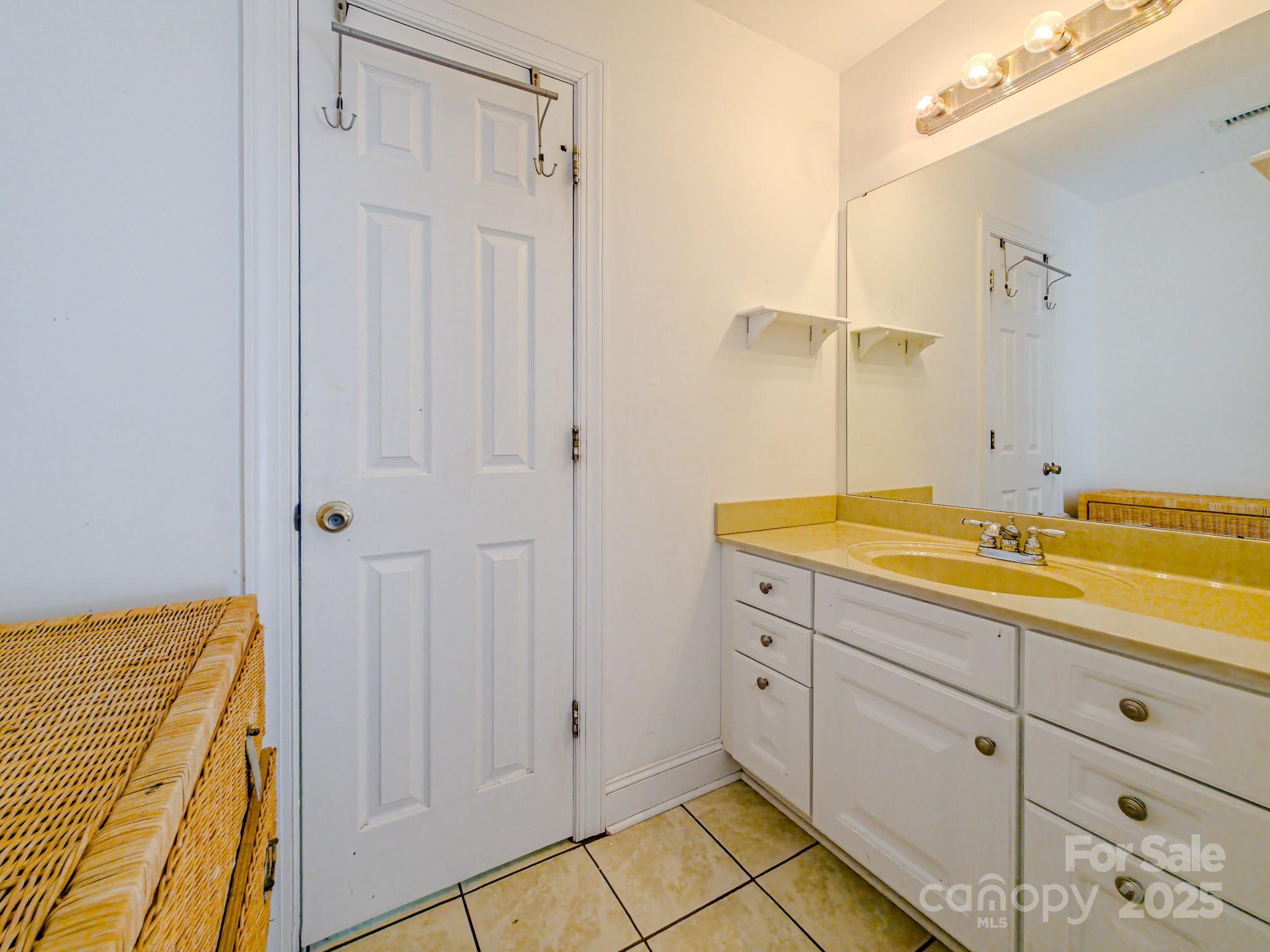 196 Col Hamptons Court Rutherfordton, NC 28139 - Photo 26 of 47 a bathroom with a sink and a mirror