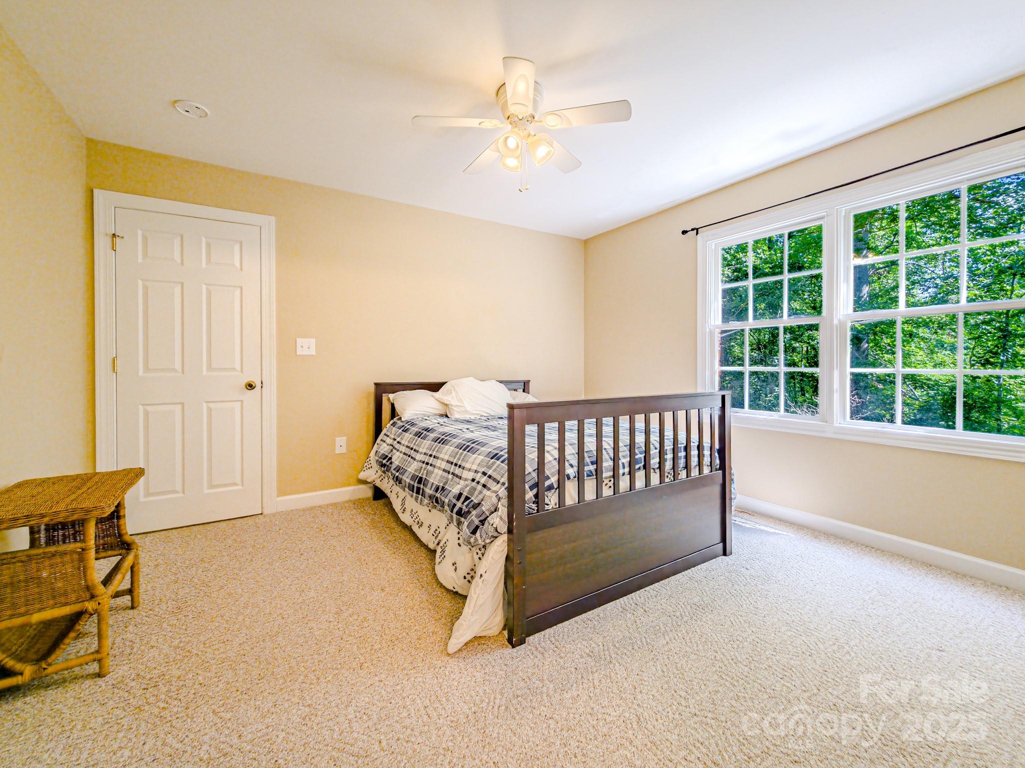 196 Col Hamptons Court Rutherfordton, NC 28139 - Photo 31 of 47 a spacious bedroom with a bed and a window