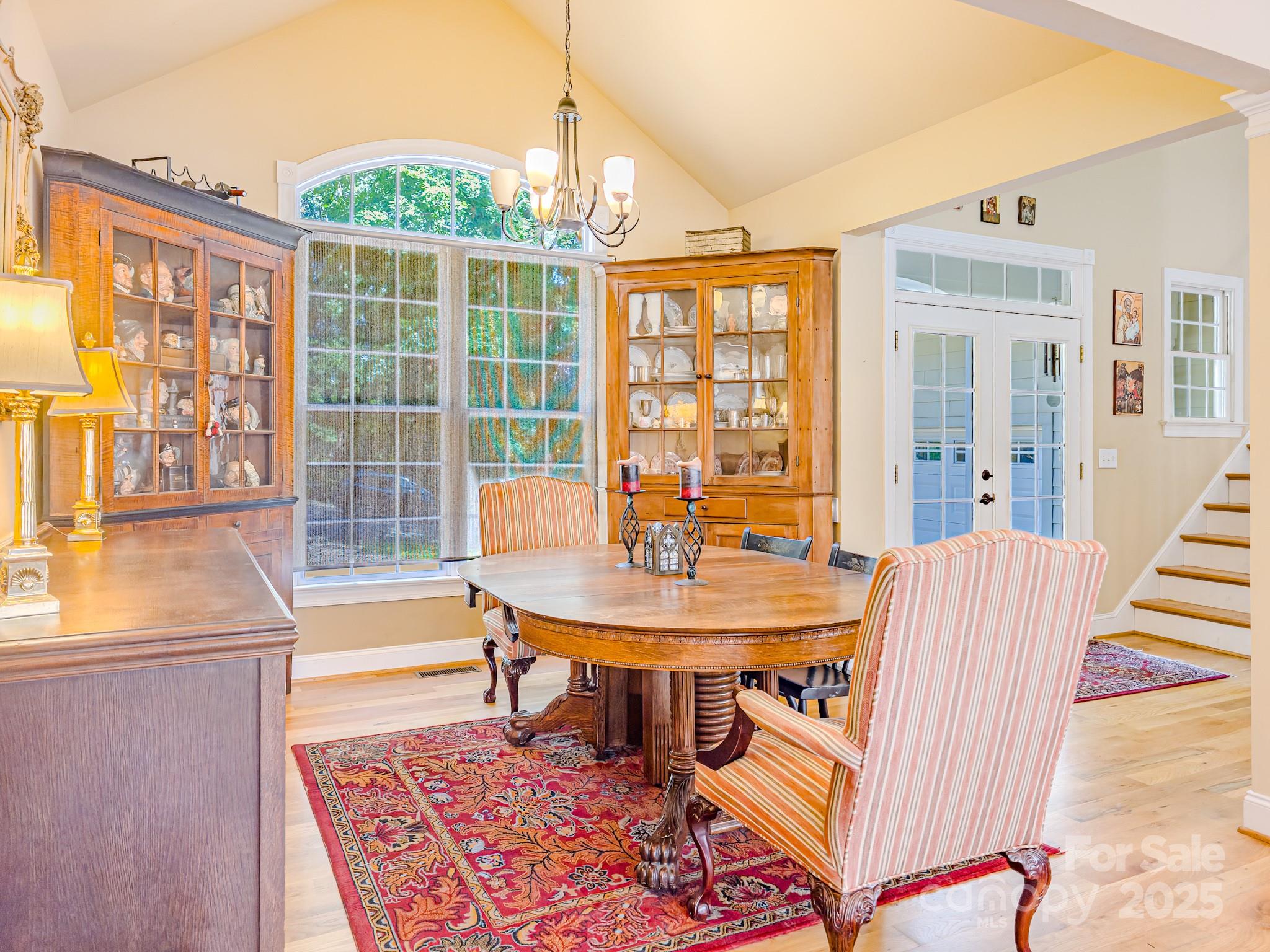 196 Col Hamptons Court Rutherfordton, NC 28139 - Photo 5 of 47 a view of a dining room with furniture wooden floor and a chandelier