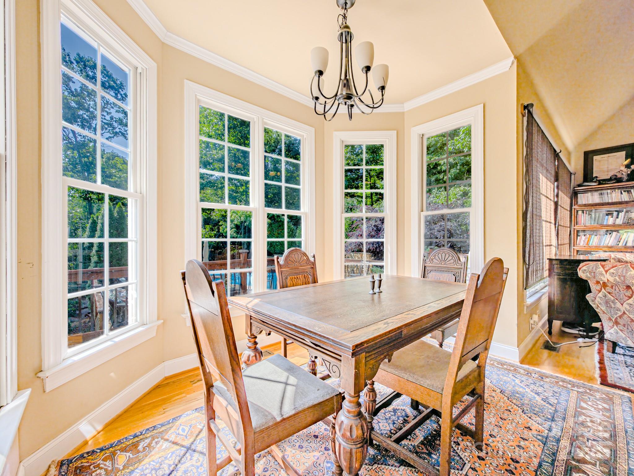 196 Col Hamptons Court Rutherfordton, NC 28139 - Photo 6 of 47 a view of a dining room with furniture large windows and wooden floor