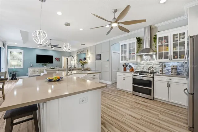 a kitchen with a sink cabinets and window