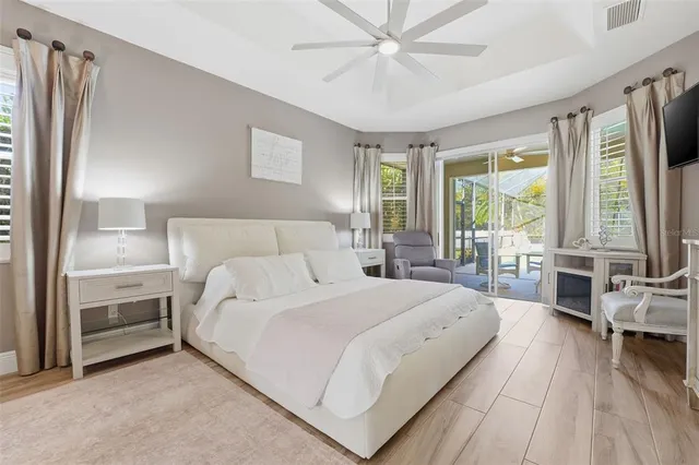 a bedroom with a large bed and a large window