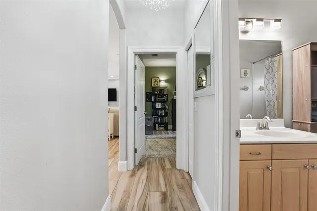 a view of a bathroom from a hallway