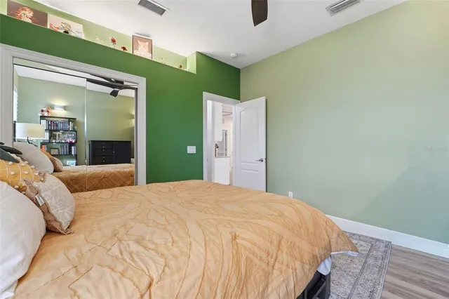 a bedroom with a bed and a dresser