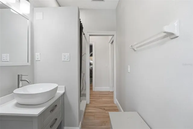 a kitchen with granite countertop a stove and a microwave