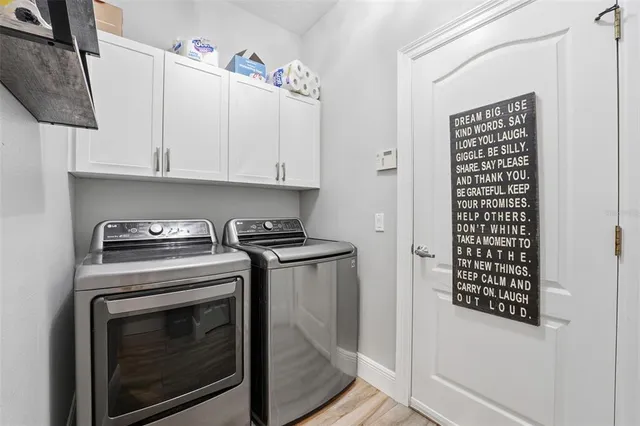 a view of a porch with chairs and backyard