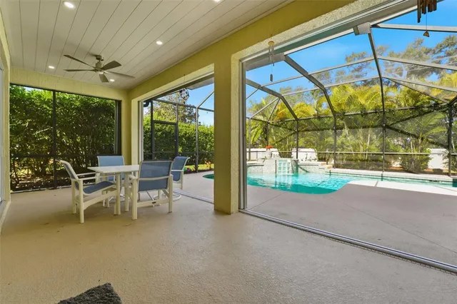 a view of a backyard with swimming pool