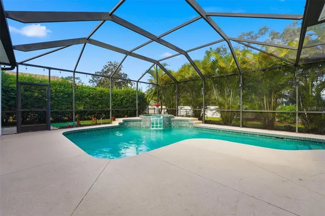 a view of a swimming pool with a patio