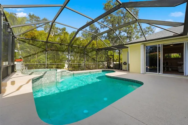 a dining room with furniture and a porch