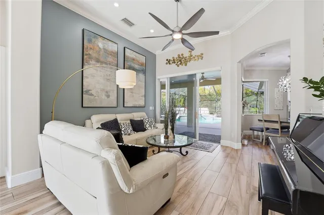 a living room with furniture and a large window