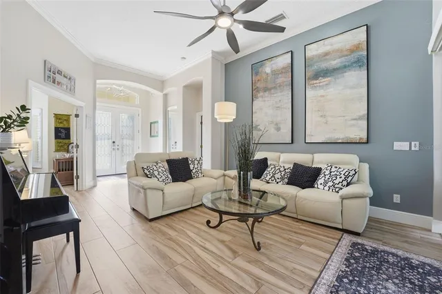 a living room with furniture and a large window