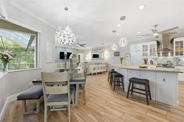 a view of a dining room with furniture window and wooden floor
