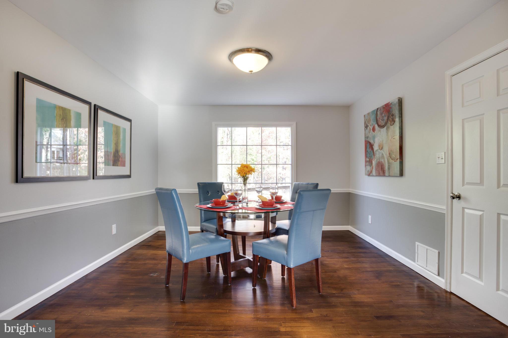 602 Pine Road Fort Washington, MD 20744 - Photo 8 of 30 a view of a dining room with furniture and wooden floor