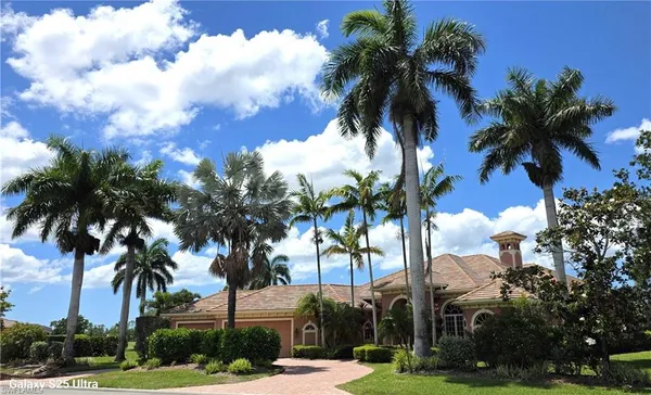a view of multiple houses with palm trees