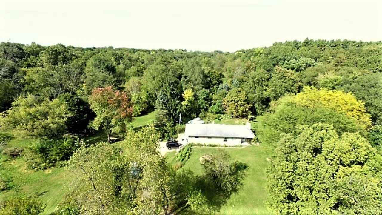 110 Lovesee Road Roscoe, IL 61073 - Photo 1 of 25 a view of a yard with a tree
