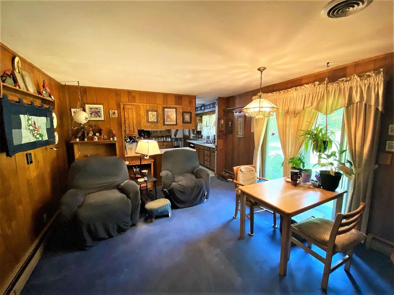 110 Lovesee Road Roscoe, IL 61073 - Photo 13 of 25 a living room with furniture and a flat screen tv