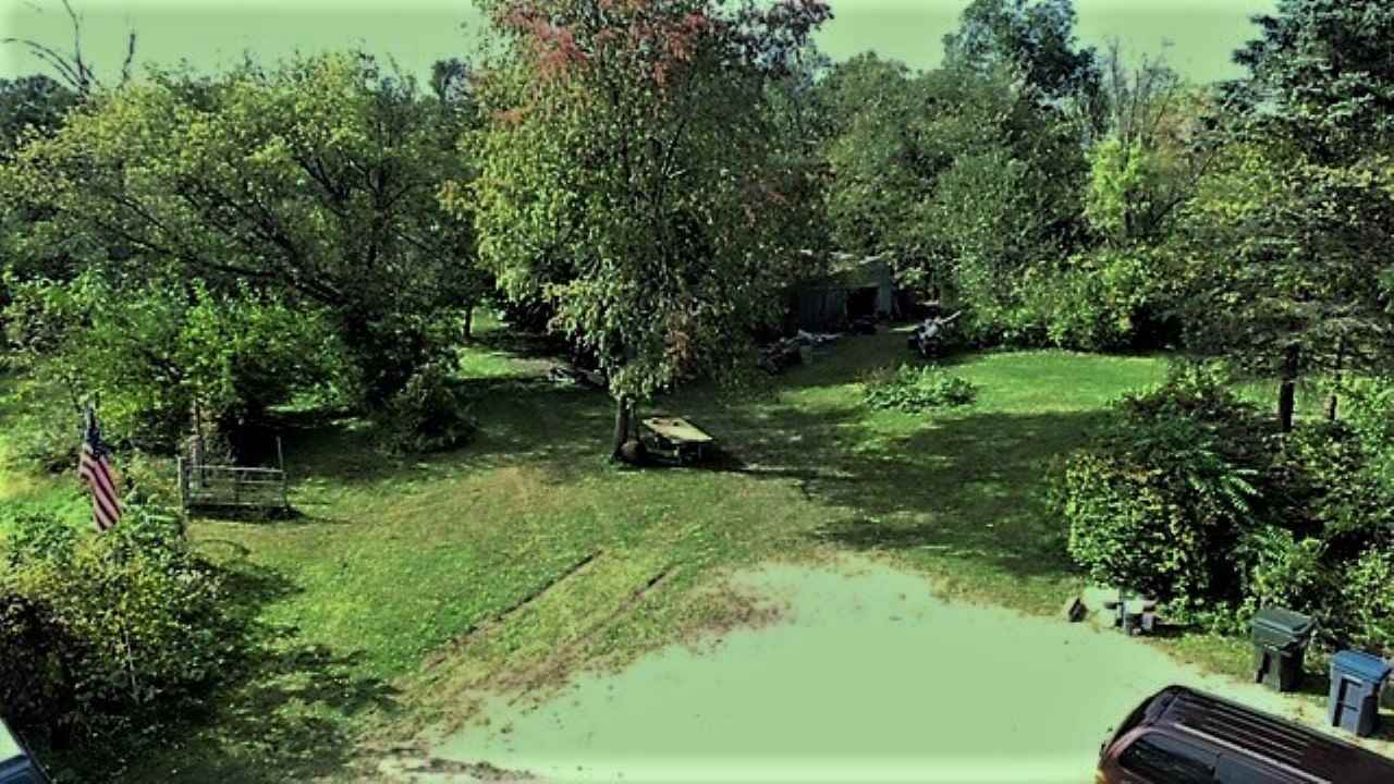 110 Lovesee Road Roscoe, IL 61073 - Photo 15 of 25 a backyard of a house with a yard and outdoor seating