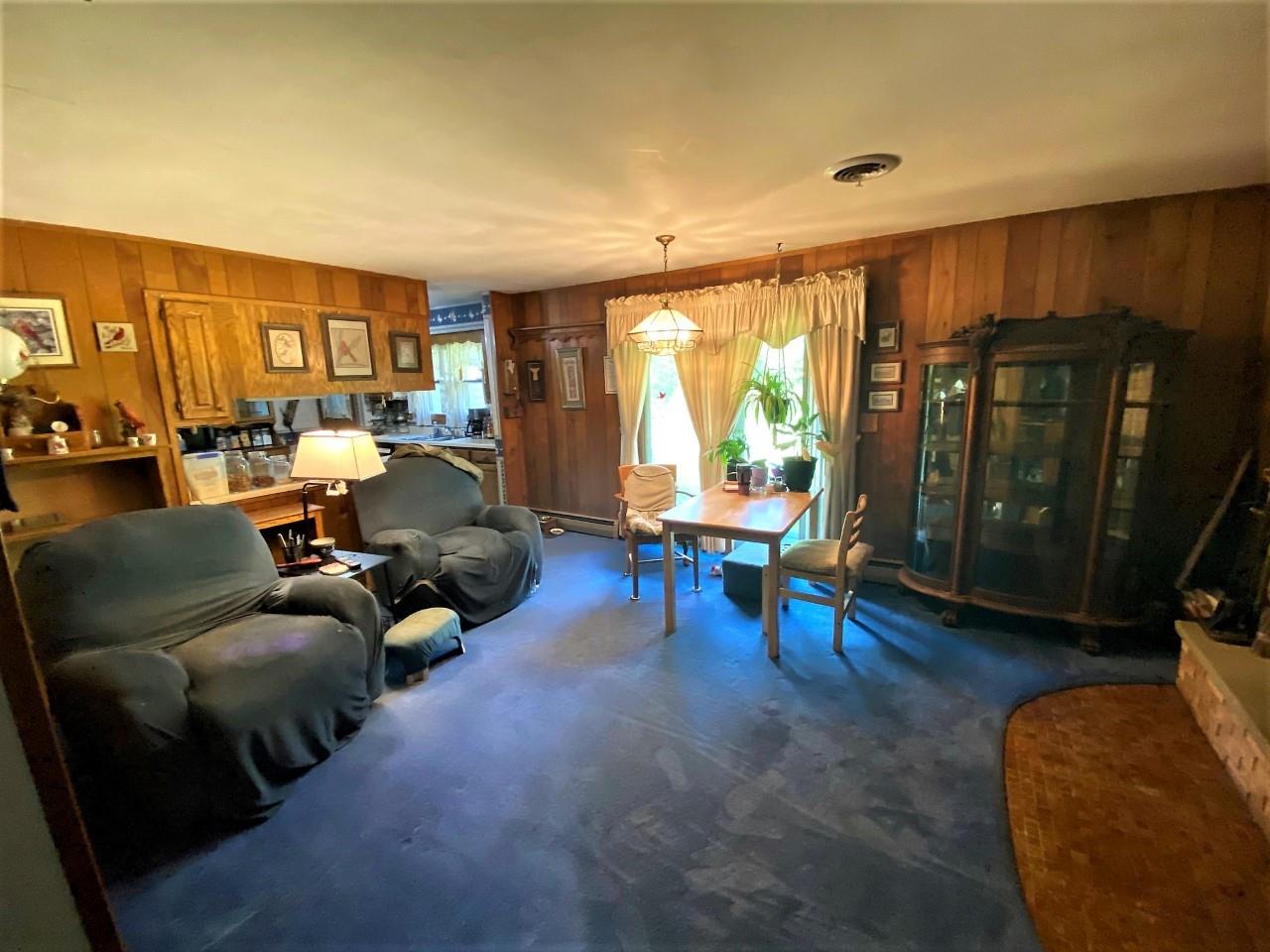 110 Lovesee Road Roscoe, IL 61073 - Photo 16 of 25 a living room with furniture and a large window