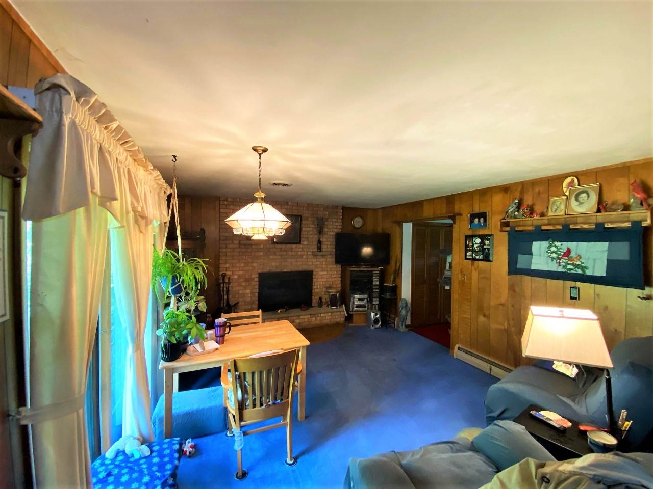 110 Lovesee Road Roscoe, IL 61073 - Photo 17 of 25 a living room with furniture a dining table with wooden floor