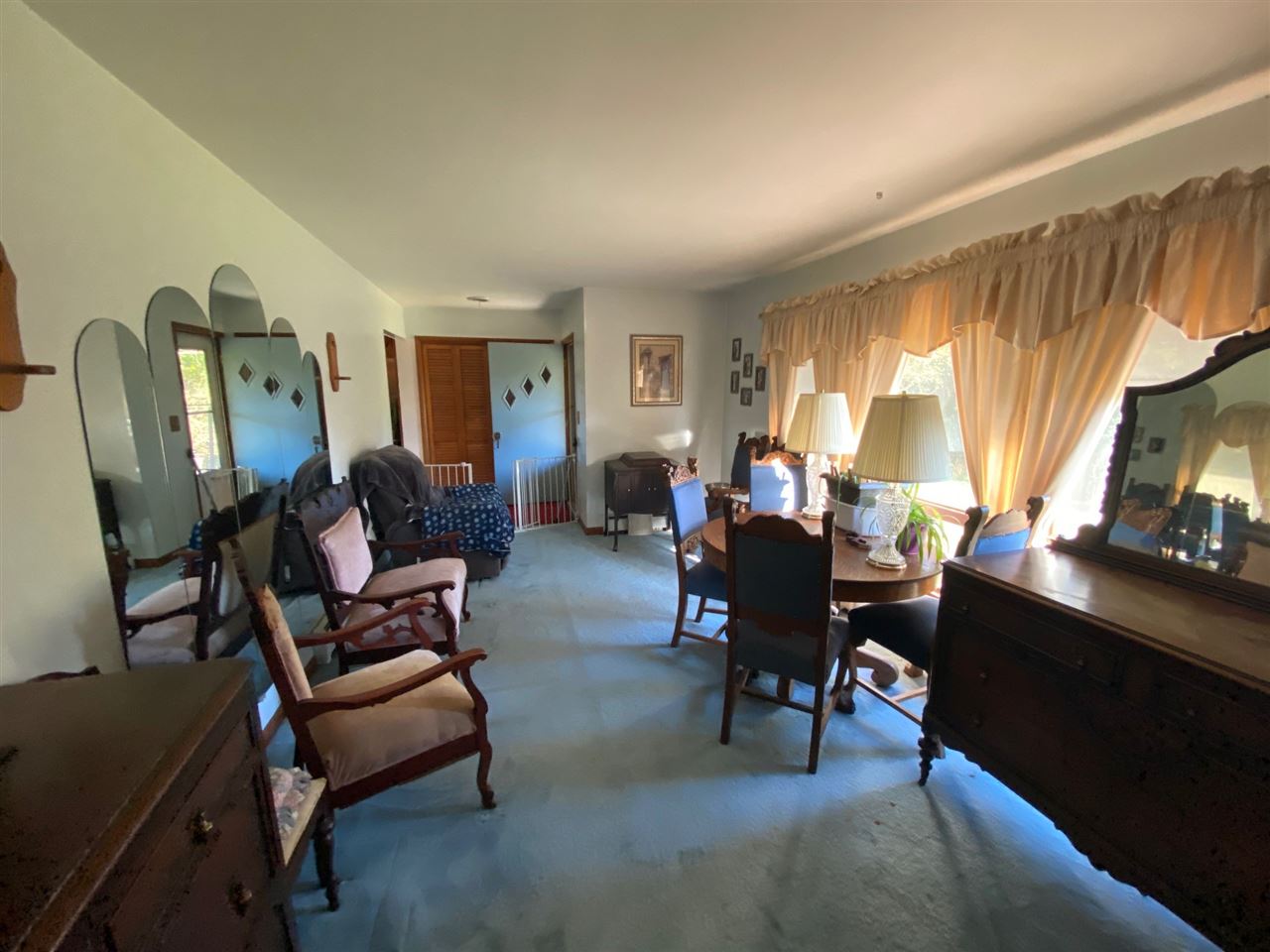 110 Lovesee Road Roscoe, IL 61073 - Photo 18 of 25 a living room with furniture a window and a flat screen tv